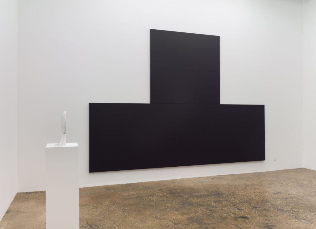 Large black painting in gallery