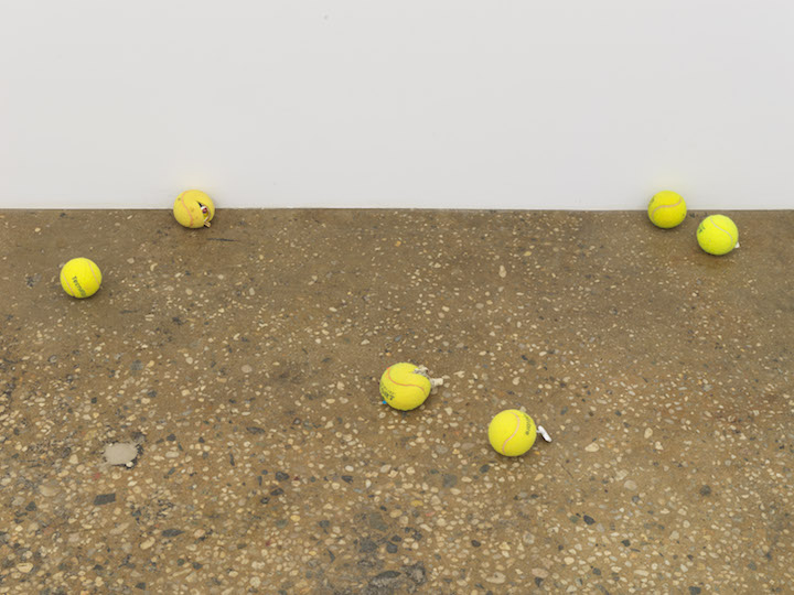 Tennis balls on floor