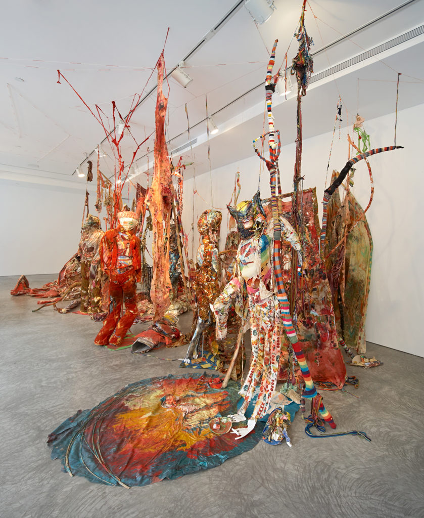 Large red sculpture in gallery