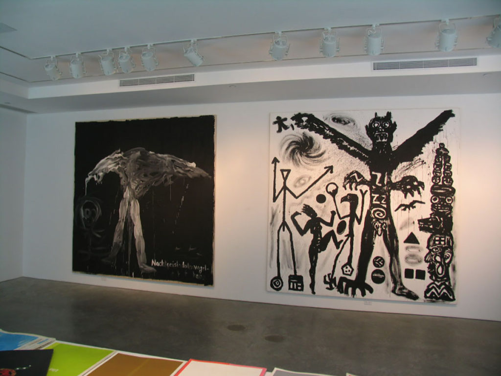 Large paintings of figures in gallery