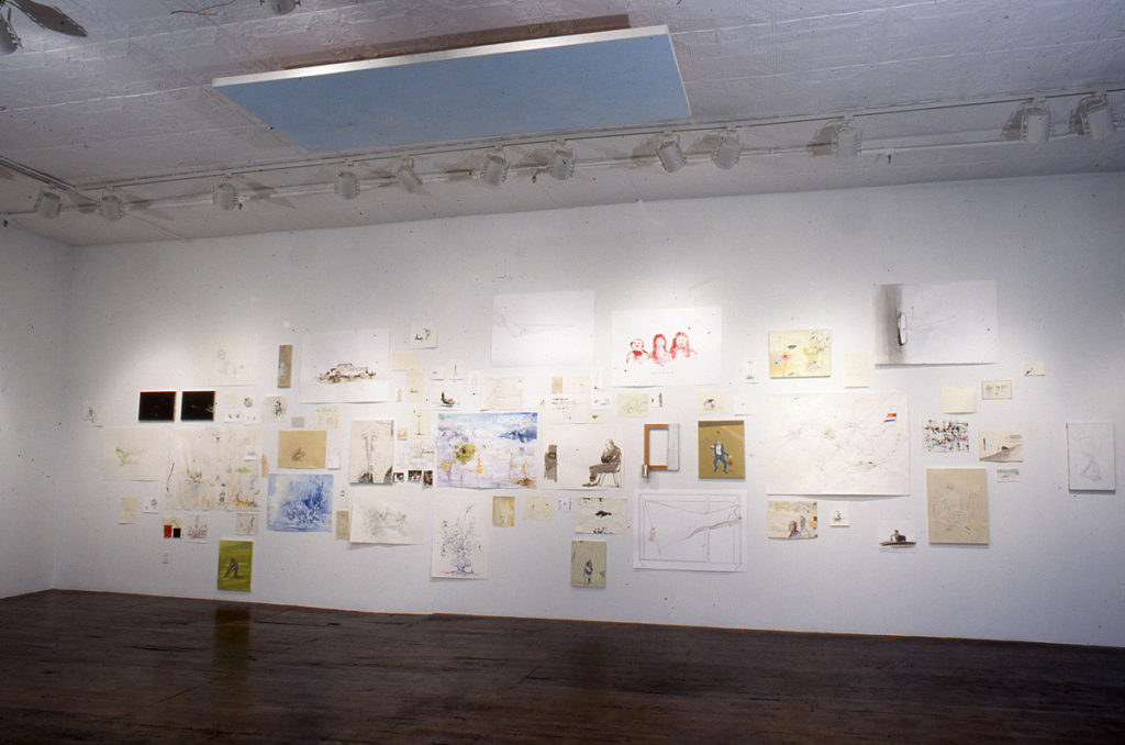 Gallery with many drawings on the wall