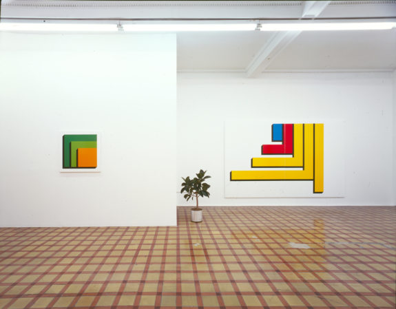 Bright geometric sculptures on wall