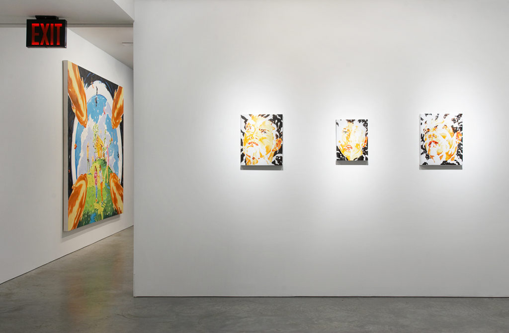 one large and three small paintings in gallery space