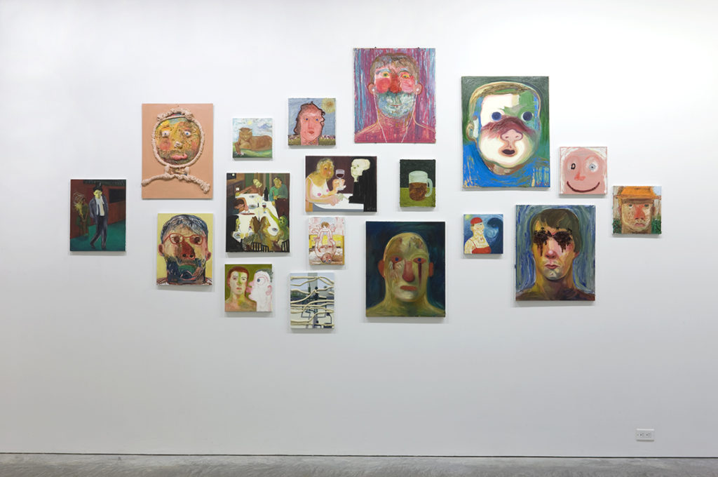 grouping of medium sized of paintings on a wall