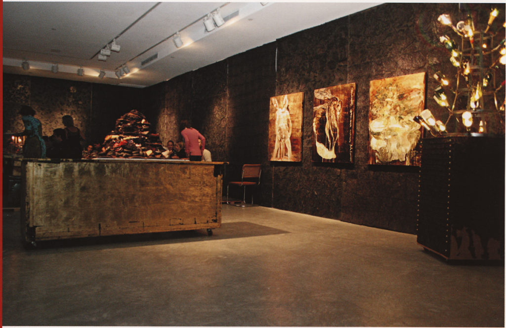 Dark gallery with gold table
