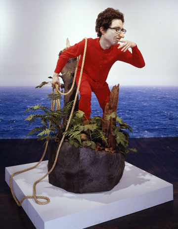 man in red outfit standing in a plant