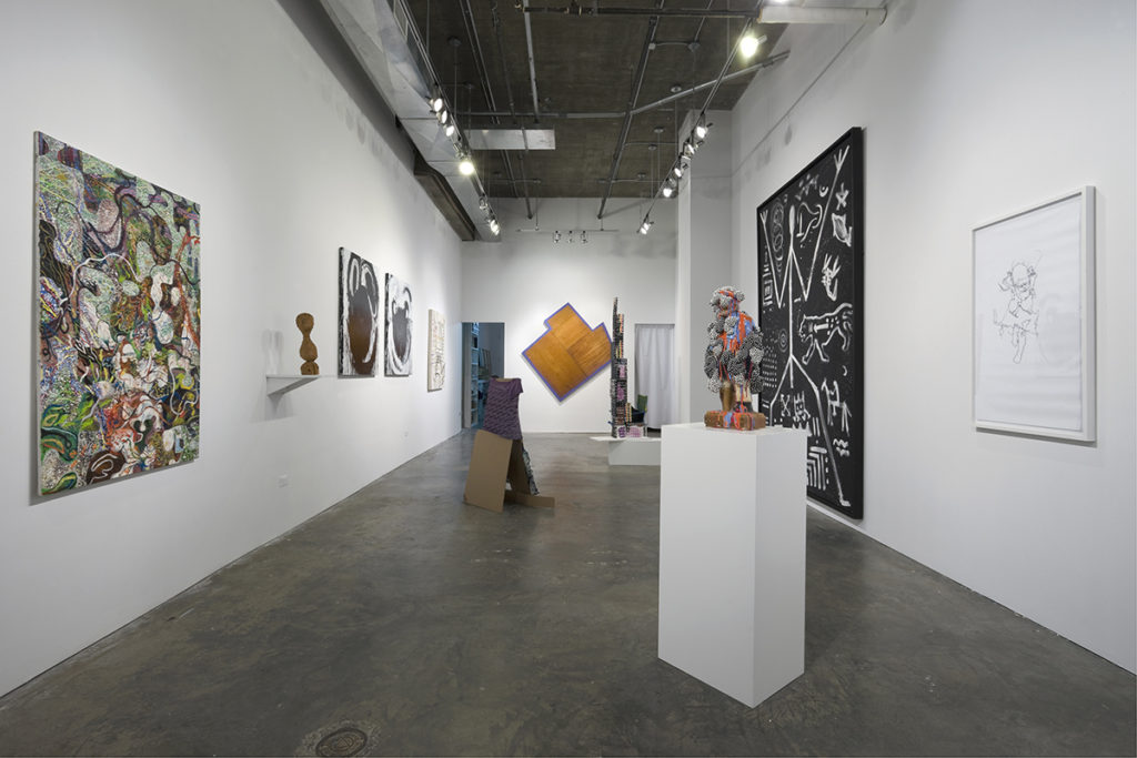 paintings and sculptures in gallery