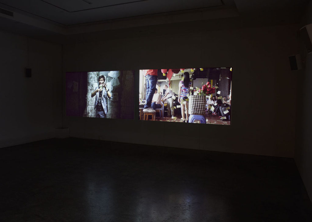 projected video in dimly lit gallery